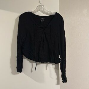 Black long sleeve top with cross ties in front